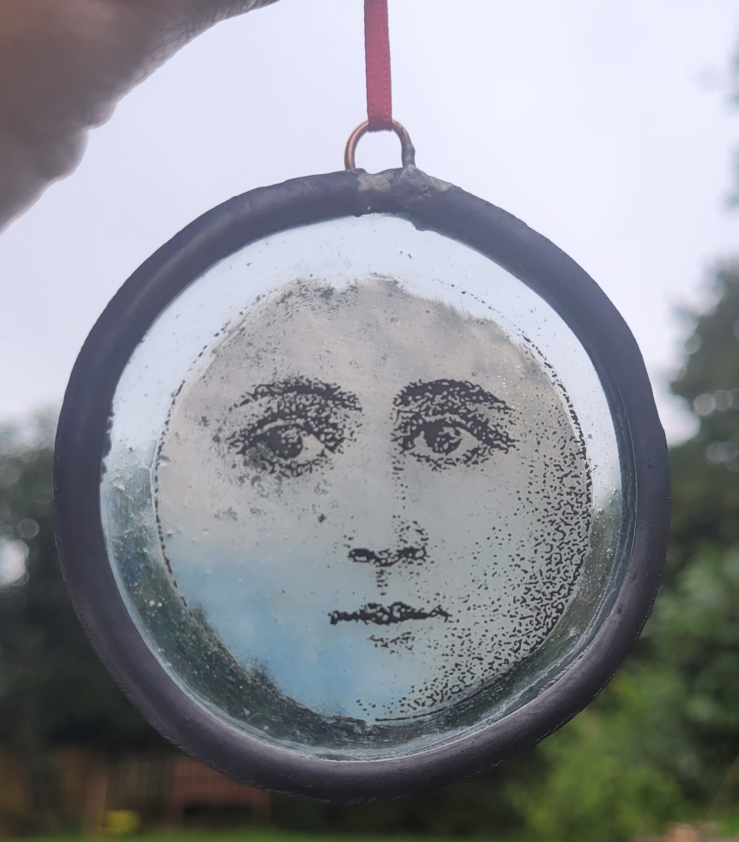 Hanging stained glass moon face panel traditionally made - fantasy art