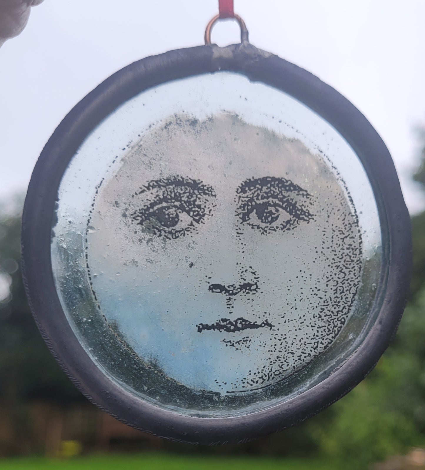 Hanging stained glass moon face panel traditionally made - fantasy art