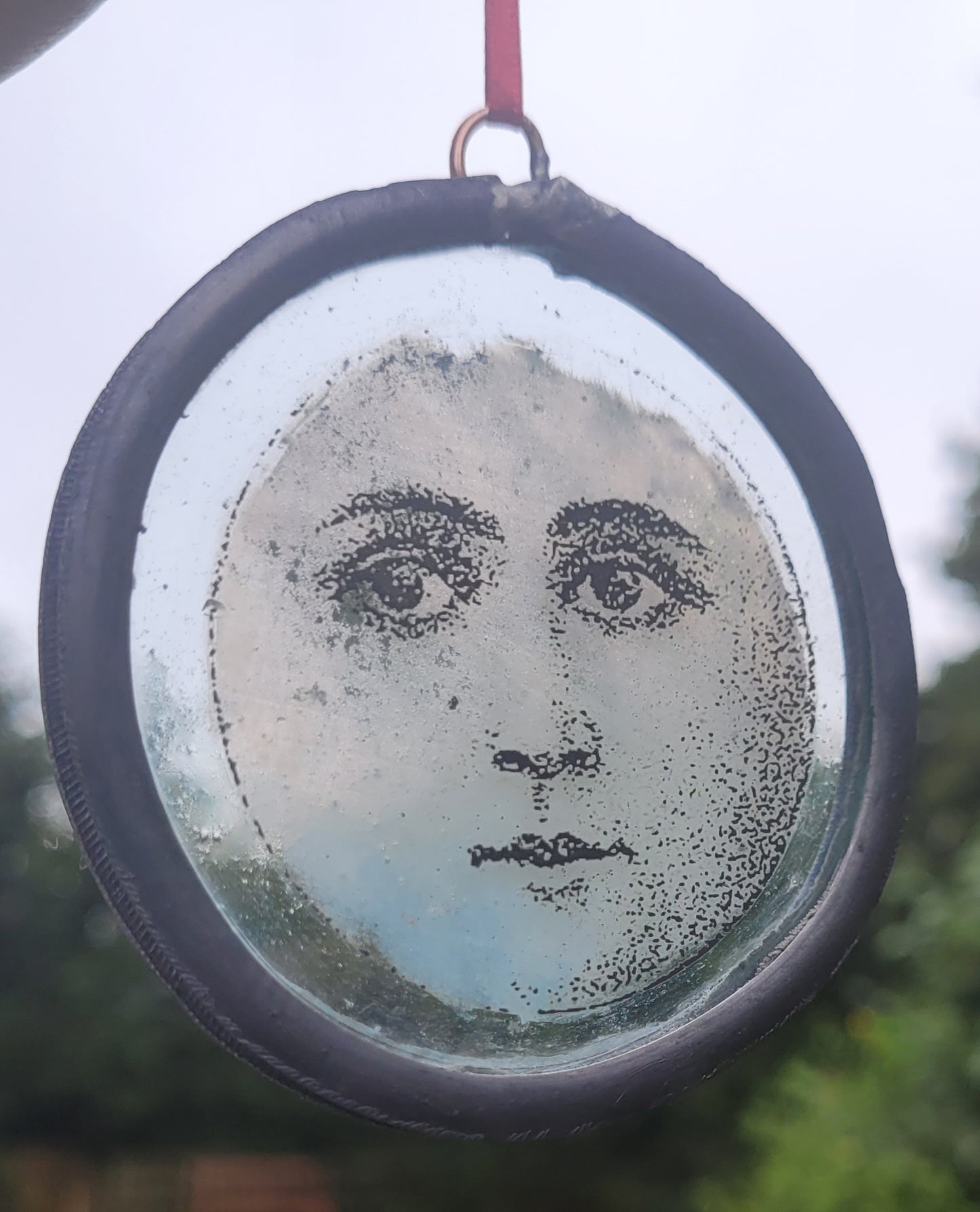 Hanging stained glass moon face panel traditionally made -  fantasy art