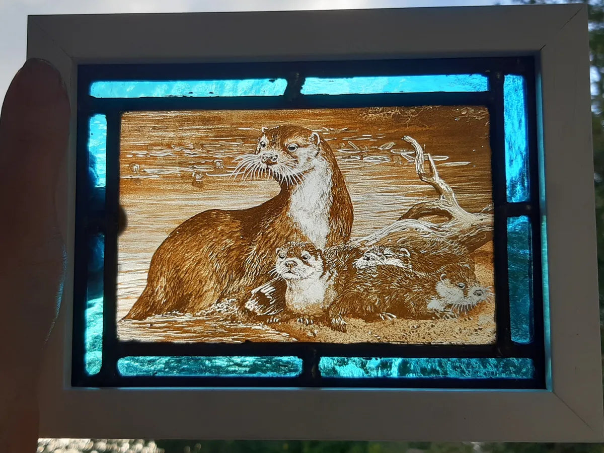 Otters stained glass panel framed