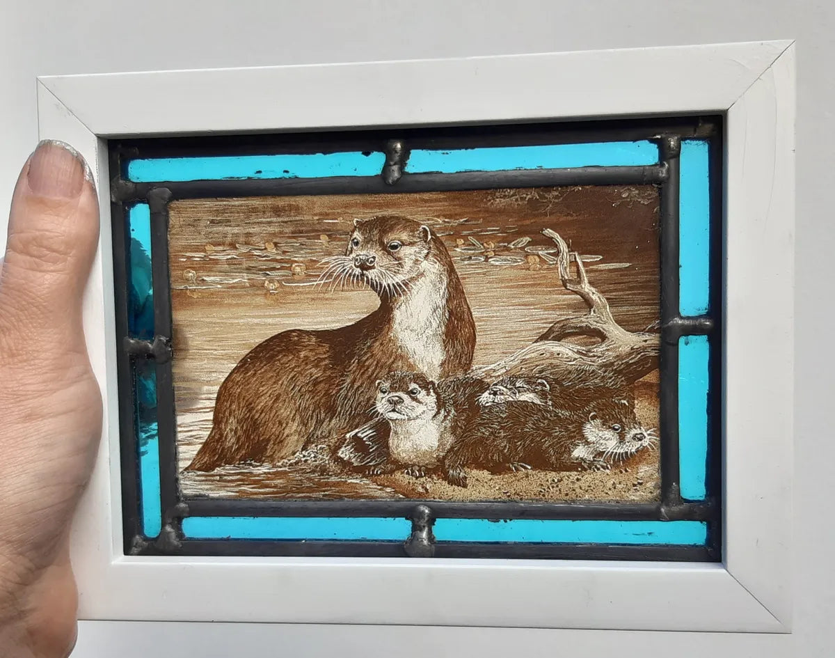 Otters stained glass panel framed